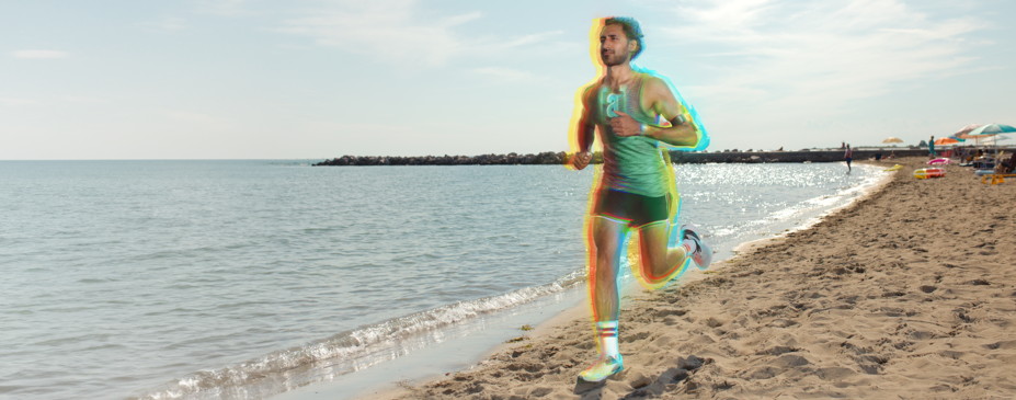 Man with healthy lifestyle running on the beach