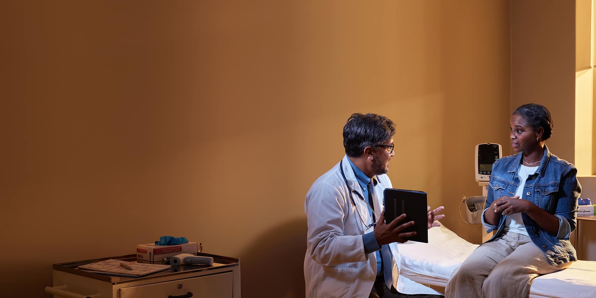 Woman and doctor discussing exam.